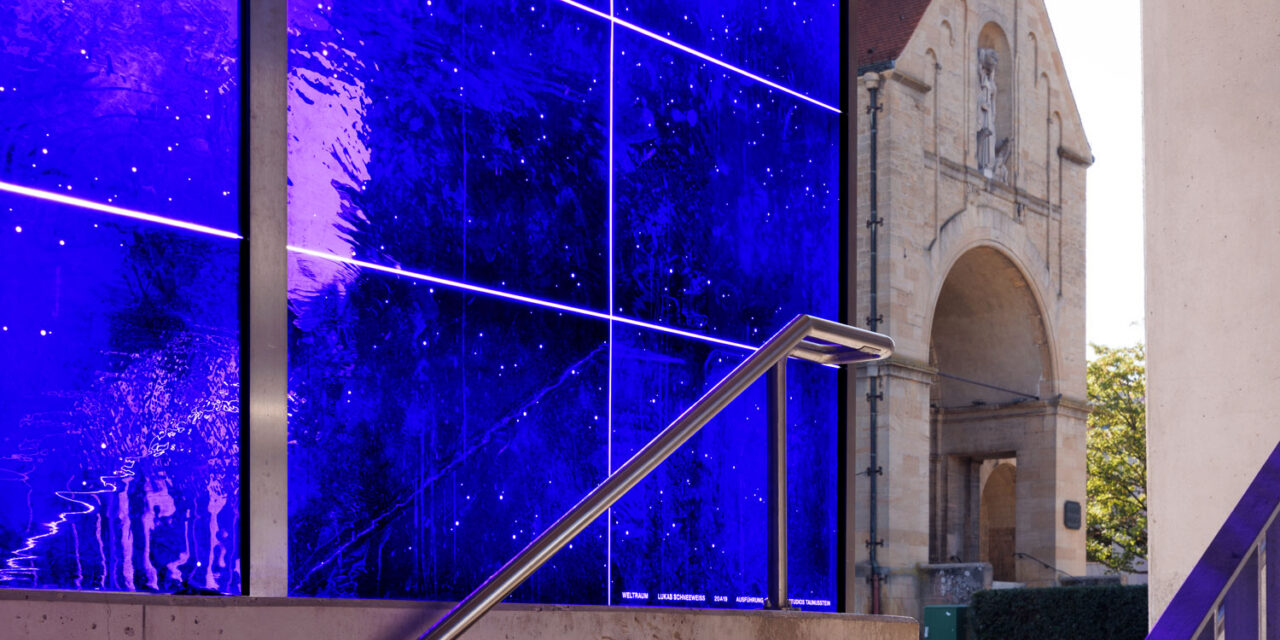 A stairwell enclosed in blue mouth-blown glass.